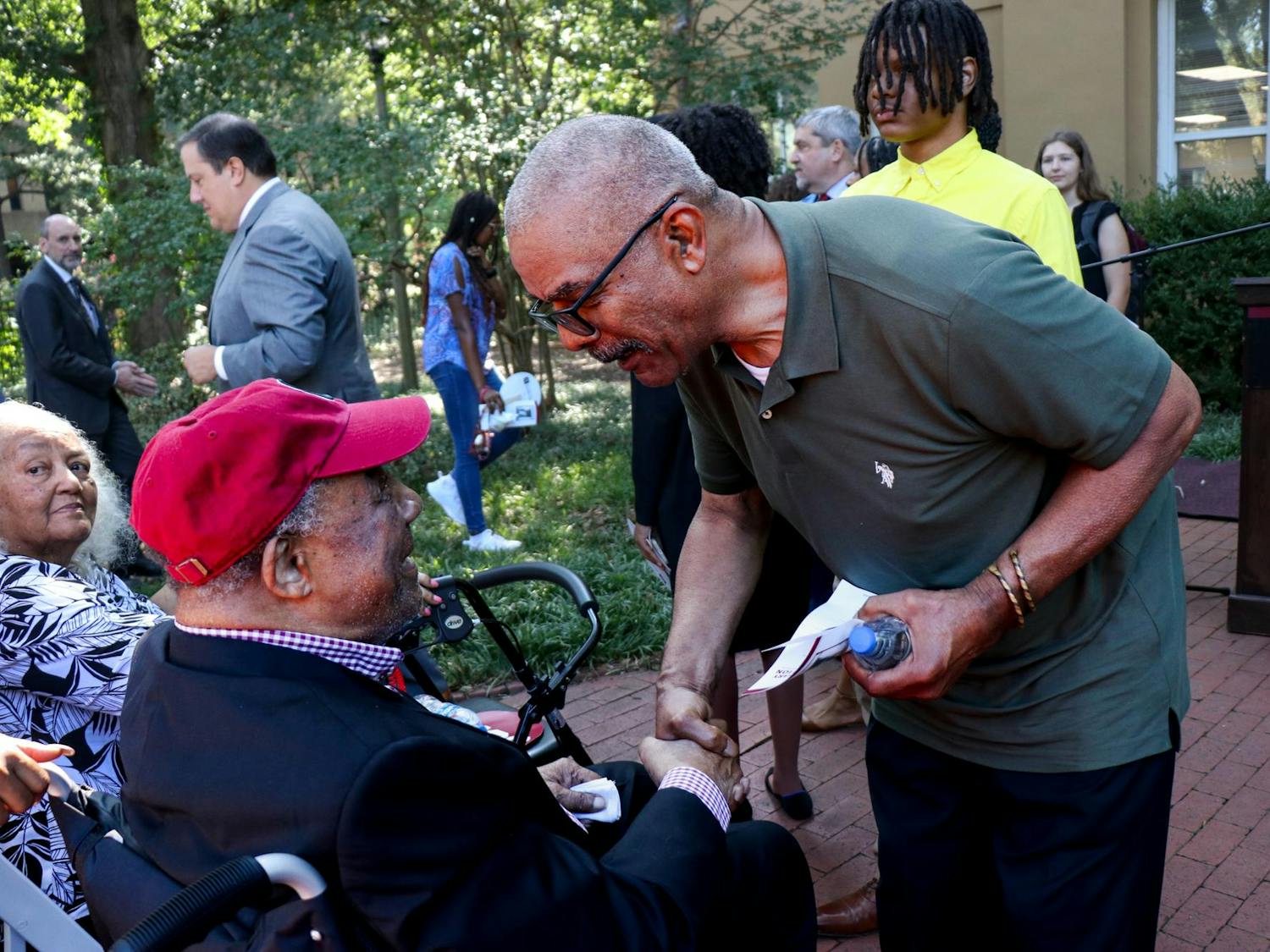 FILE — James L. Solomon Jr. (left) greets attendants of the 60th Anniversary of Desegregation event at LeConte College on Sept. 11, 2023. Solomon Jr. was the first Black graduate student in mathematics at the University of South Carolina.