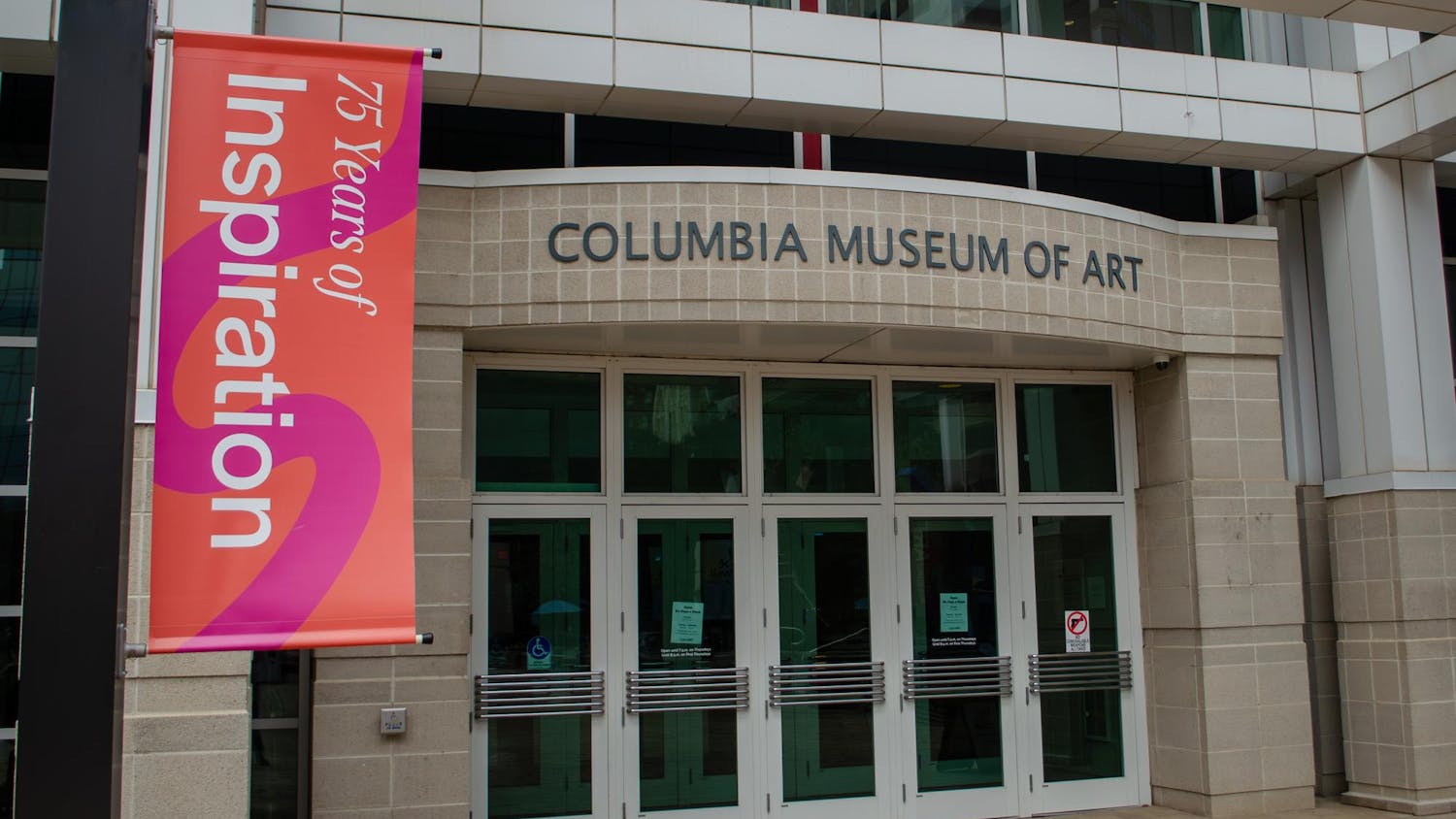 The main entrance to the Columbia Museum of Art in Boyd Plaza at 1515 Main Street, Columbia, South Carolina, on Jan. 14, 2026. A banner promotes the 75th anniversary of the museum, which coincides with the reopening of its second-floor galleries.