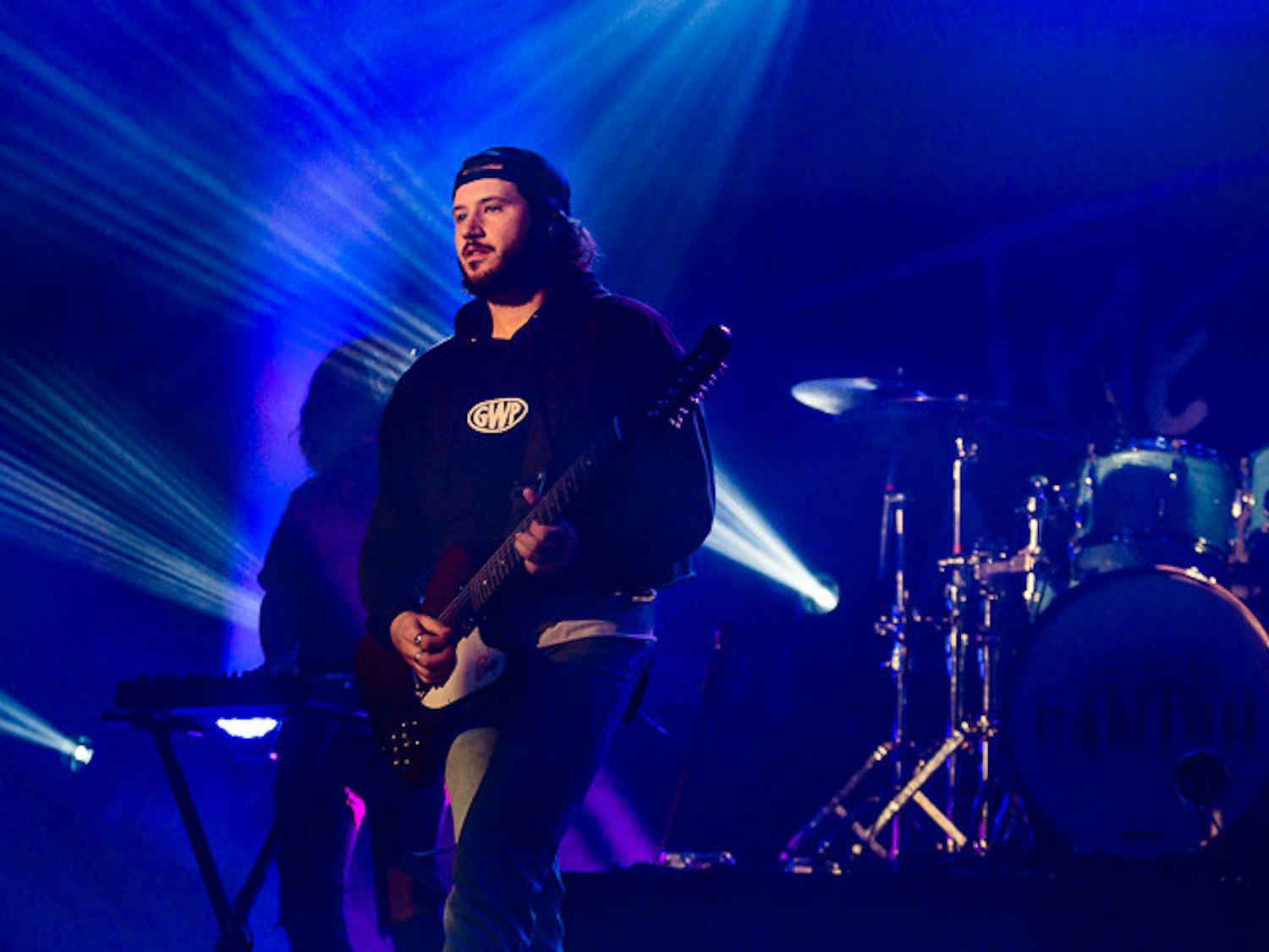The Band CAMINO singer and guitarist Spencer Stewart (on left) plays the guitar as he walks to the front of the stage. The Band CAMINO performed at The Senate on Sept. 15, 2022.