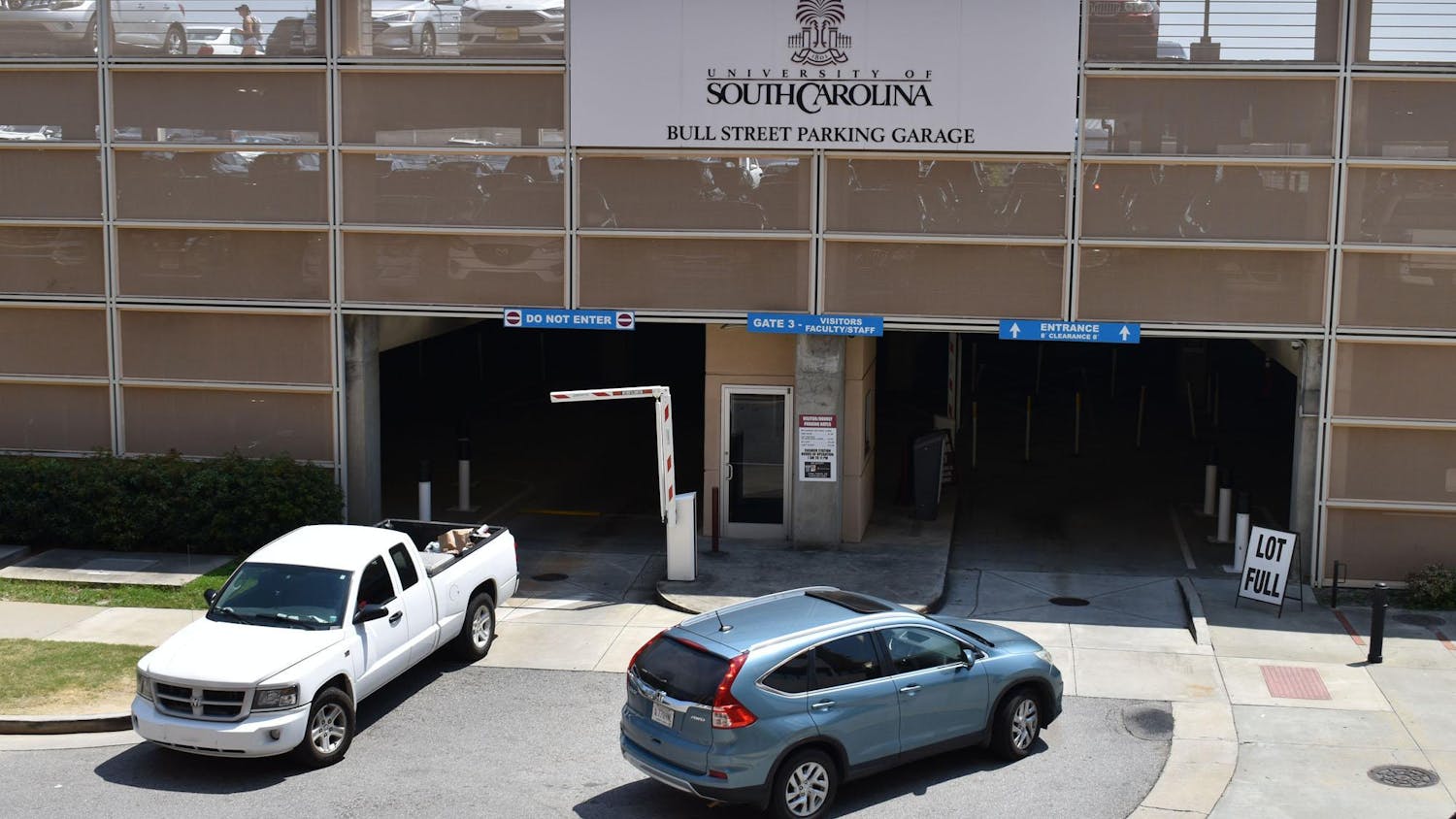 Vehicles enter and exit Bull Street Garage on Aug. 24, 2023. USC students are required to have a permit or pass to park at designated lots and garages, including Bull Street.