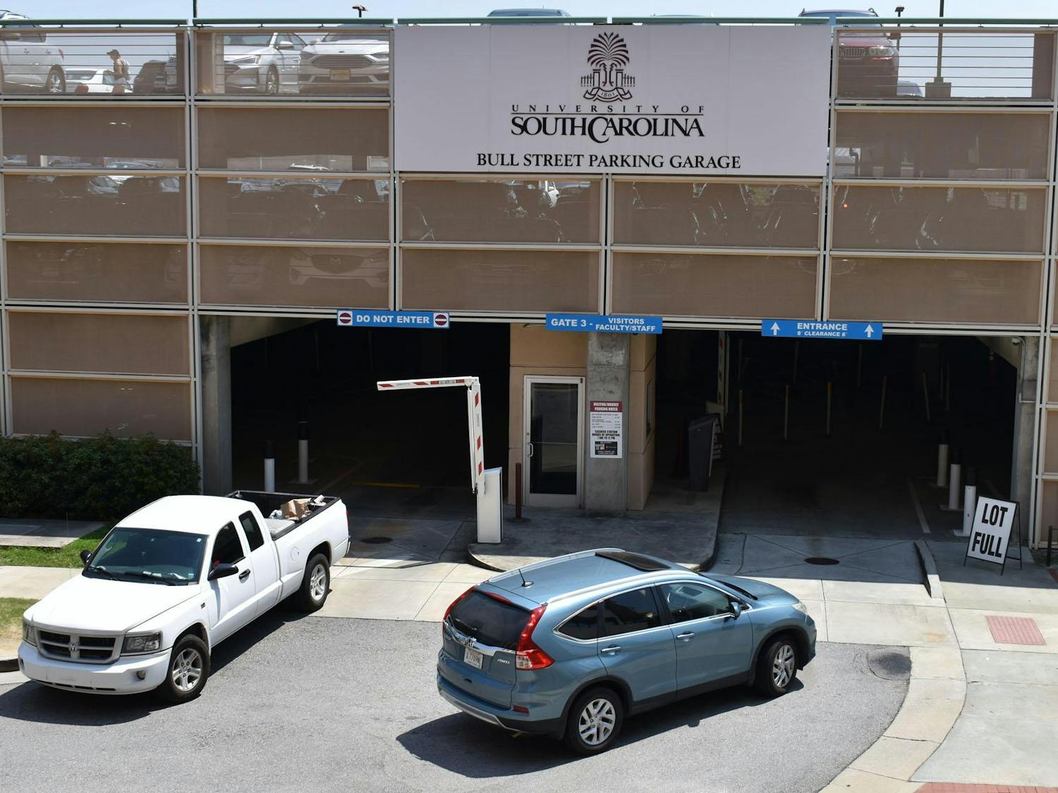 Vehicles enter and exit Bull Street Garage on Aug. 24, 2023. USC students are required to have a permit or pass to park at designated lots and garages, including Bull Street.