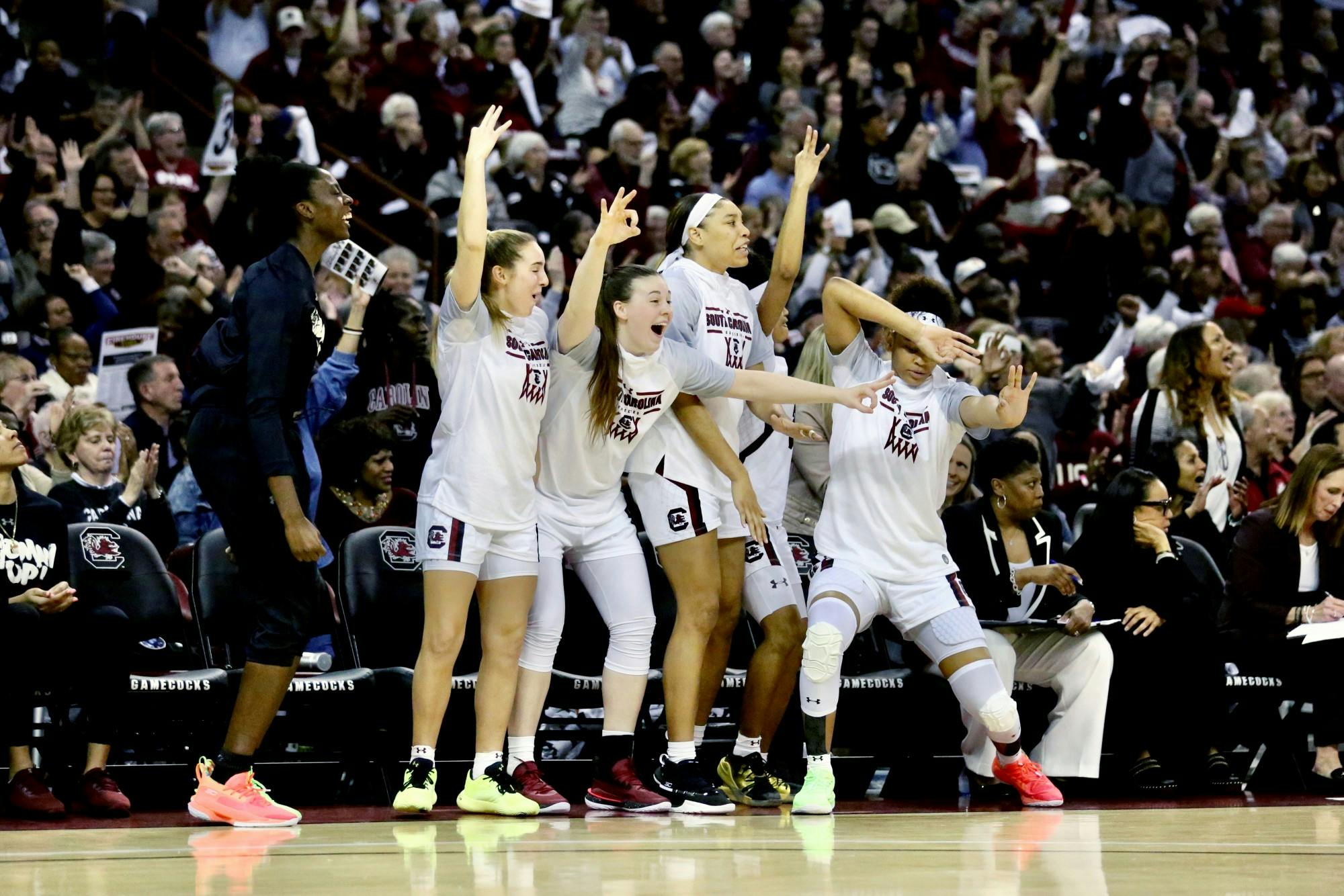 The Gamecock women's basketball team celebrates after one of its players scored a 3-point shot during the second half of the game against UConn on Feb. 11, 2020. 
