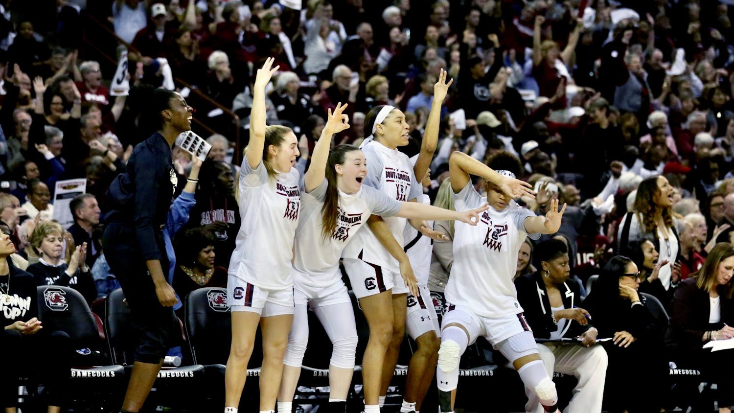 The Gamecock women's basketball team celebrates after one of its players scored a 3-point shot during the second half of the game against UConn on Feb. 11, 2020. 

