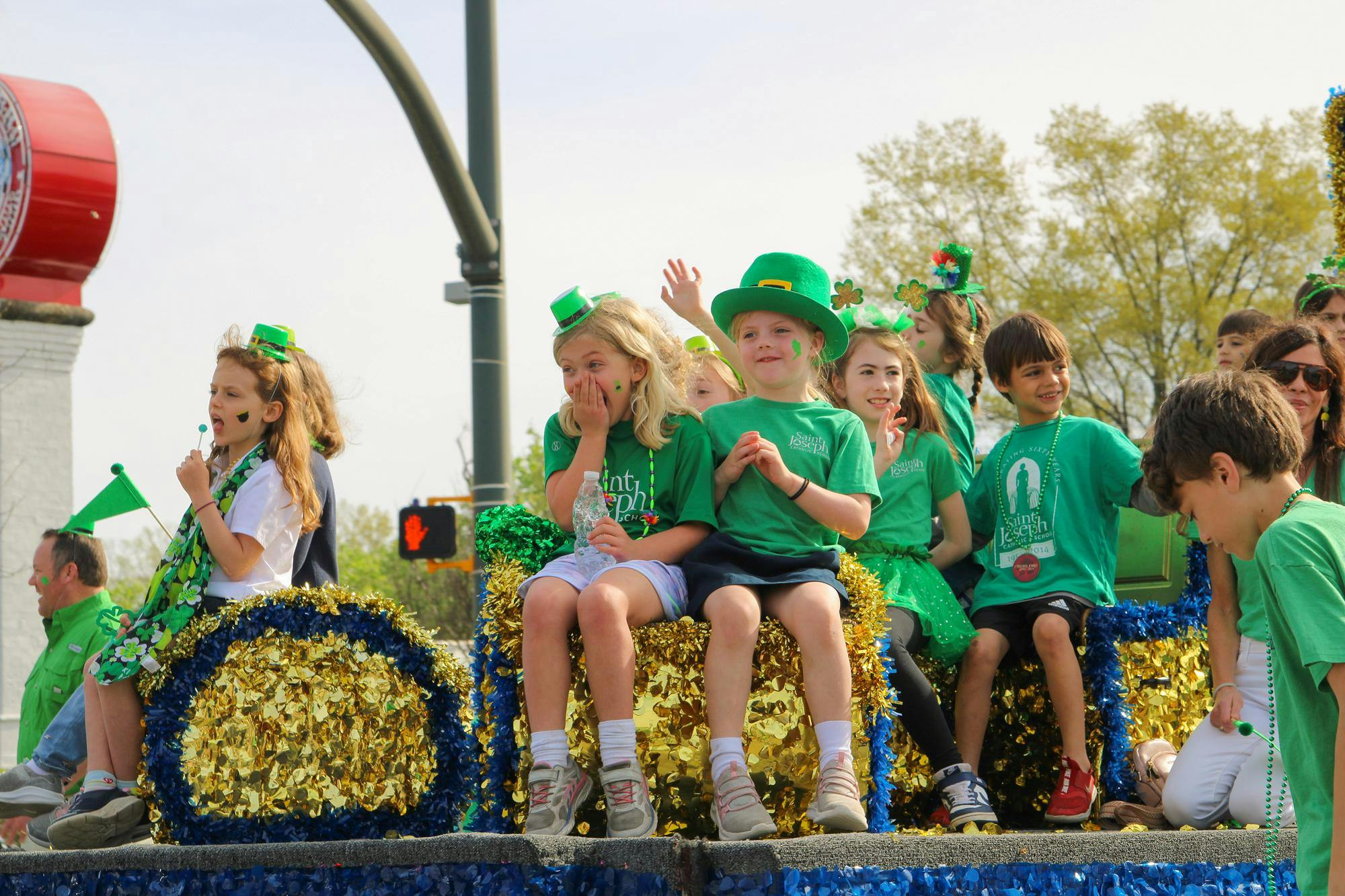 FILE —&nbsp;Children greet the crowd as they walk in the St. Pat’s in Five Points parade on March 16, 2024. The parade is part of an annual all-day festival full of St. Patrick’s Day festivities in Five Points.