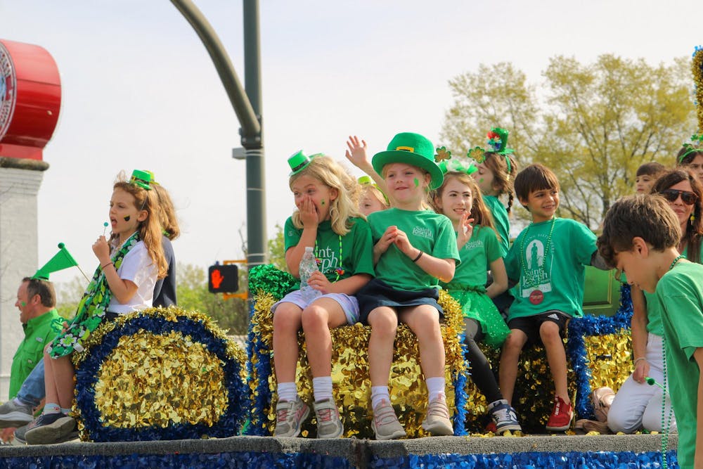 <p>FILE —&nbsp;Children greet the crowd as they walk in the St. Pat’s in Five Points parade on March 16, 2024. The parade is part of an annual all-day festival full of St. Patrick’s Day festivities in Five Points.</p>