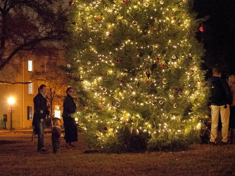 The Christmas tree on the Horseshoe was lit Tuesday evening, but the annual celebration was moved indoors.