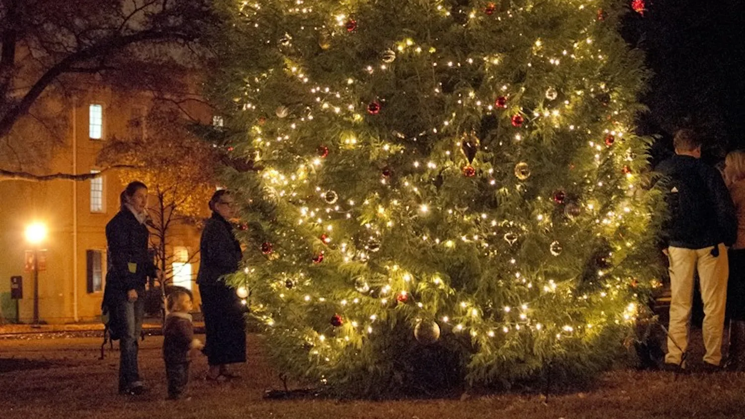 The Christmas tree on the Horseshoe was lit Tuesday evening, but the annual celebration was moved indoors.