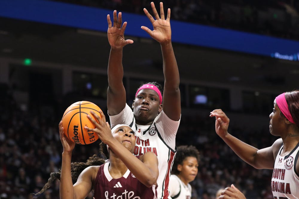 <p>Senior center Madina Okot blocks a Mississippi State player’s shot in the Gamecocks' matchup against the Bulldogs on Feb. 5, 2026. The Gamecocks defeated the Bulldogs with a final score of 88-45.</p>