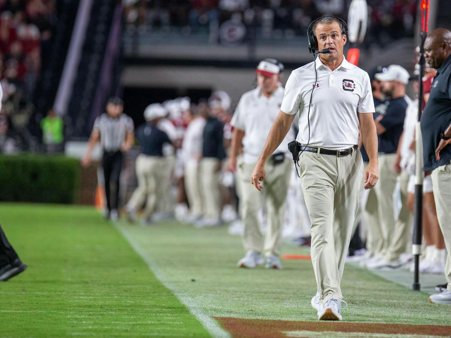 Head coach Shane Beamer walks the sideline during South Carolina's game against Akron on Sept. 21, 2024 at Williams-Brice Stadium. 2024 marks Beamer's fourth year leading the Gamecocks.