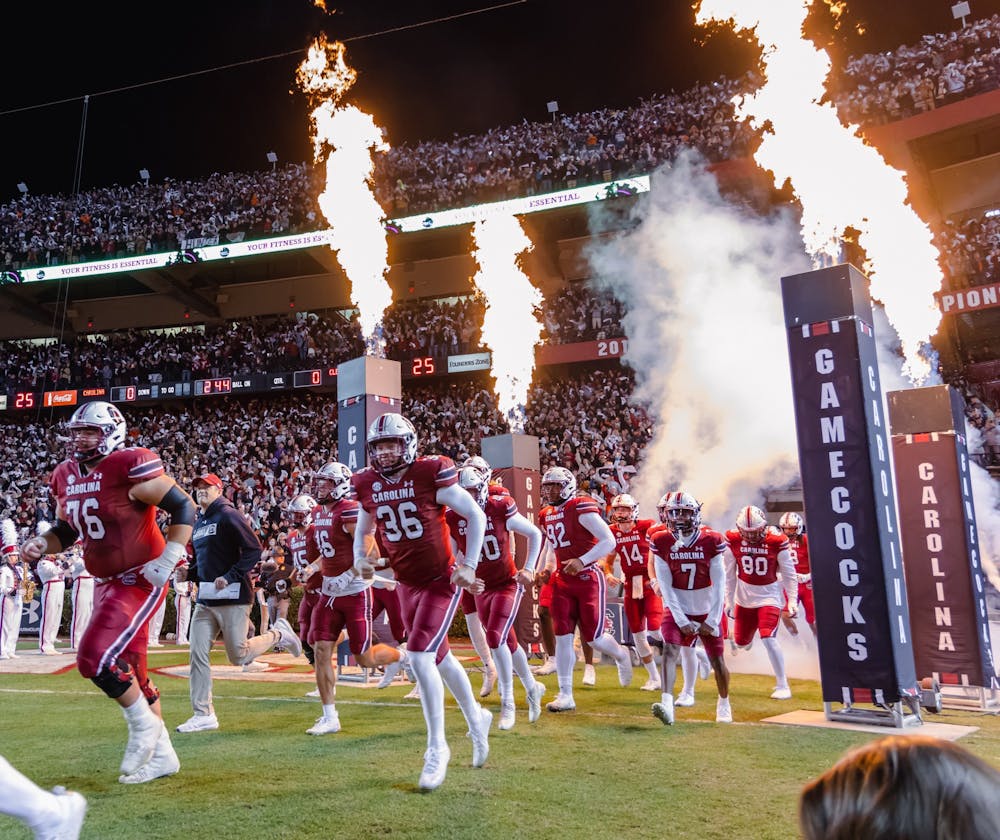 <p>The South Carolina Gamecocks and Head Football Coach Shane Beamer enter the field as they get ready to play against the Clemson Tigers for the Palmetto Bowl on Nov. 27, 2021.&nbsp;</p>