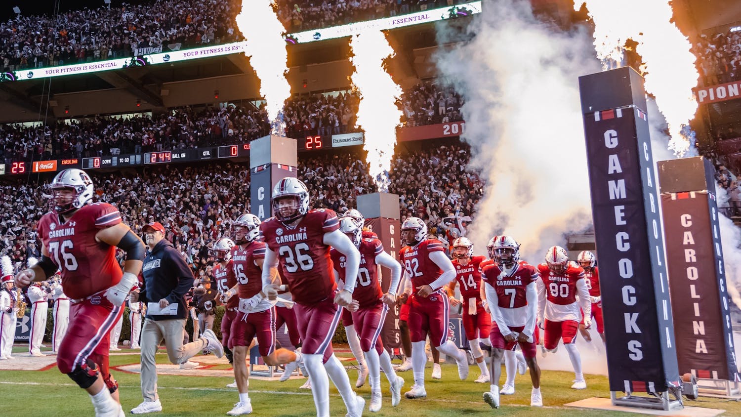 The South Carolina Gamecocks and Head Football Coach Shane Beamer enter the field as they get ready to play against the Clemson Tigers for the Palmetto Bowl on Nov. 27, 2021. 