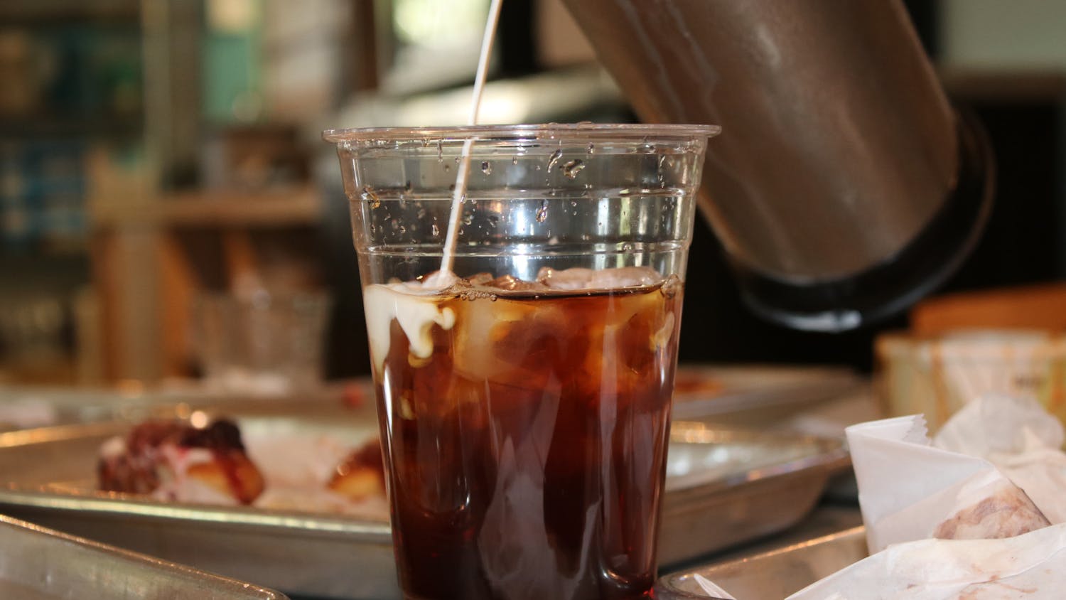 A photo of The Devine Cinnamon Roll Deli's locally sourced ice coffee on Sept. 6. Owner Jody Kreush sources from a South Carolina local who farms the beans in Brazil and brews the coffee right here in Columbia.&nbsp;