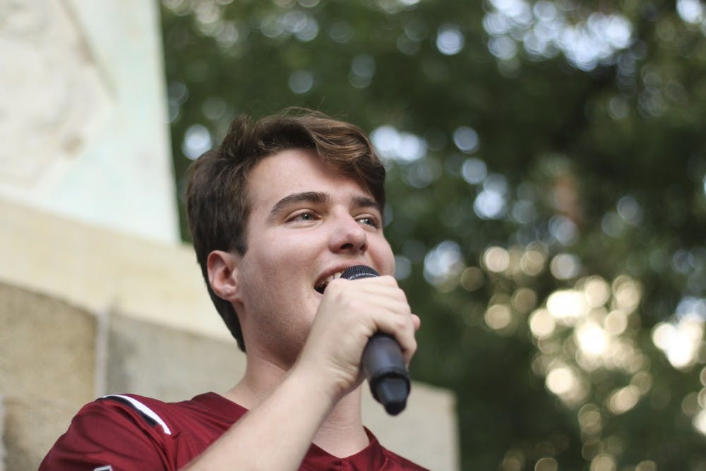 <p>Student body president Luke Rankin speaks to students at "First Night Carolina" on the horseshoe, Wednesday evening.&nbsp;</p>