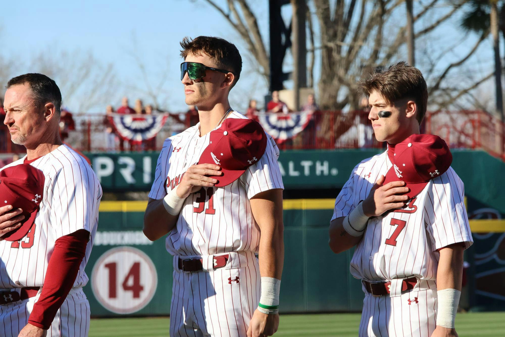 Junior outfielder Nathan Hall and Junior infielder Henry Kaczmar stand for the national anthem before the home opener against Scared Heart for the University of South Carolina baseball team on Feb. 14, 2025. The Gamecocks defeated the Pioneers 5-3.