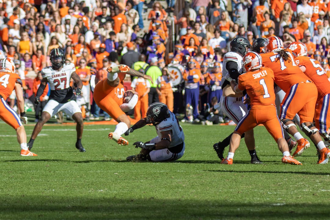 Redshirt sophomore linebacker Debo Williams tackles the Clemson ball carrier on Nov. 26, 2022 at Memorial Stadium. Williams contributed to the 48 total tackles made by the Gamecocks.