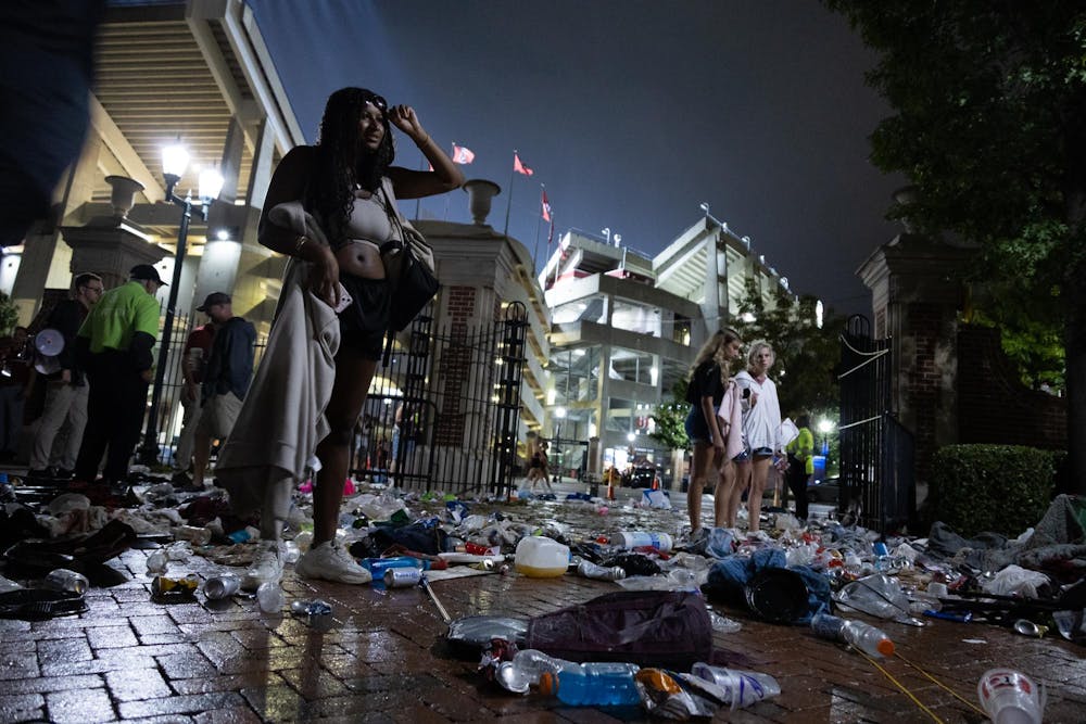 <p>Garbage consisting of beer cans, water jugs, signs and students’ belongings line the entrance of Gamecock Park where people gathered ahead of ESPN's College GameDay’s live show on Sept. 14. This was the first time in 10 years GameDay as come to Columbia, bringing large crowds.</p>