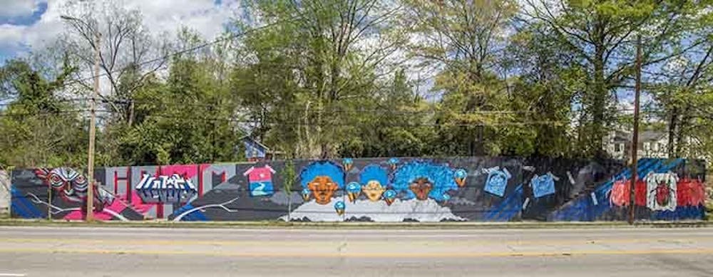 <p>Photo of the triptych mural on Millwood Avenue. This mural was created by Karl Zurfluh, Brandon Donahue and Cedric Umoja.</p>