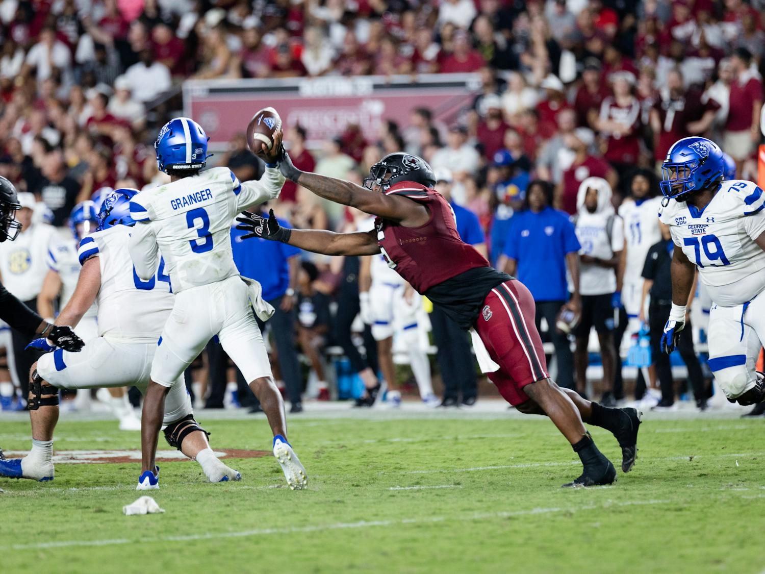 Junior edge rusher Jordan Burch reaches to knock the ball out of his opponent's hands during a game against Georgia State on Sept. 3, 2022. The Gamecocks won 35-14. &nbsp;