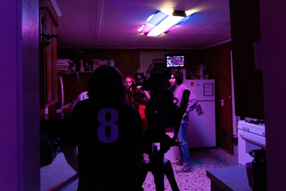 <p>USC alumnus John Slice gives instructions from behind the camera during a party scene on June 16, 2022. Slice and his friends finished filming their first feature film, "To What End," on June 24.&nbsp;</p>