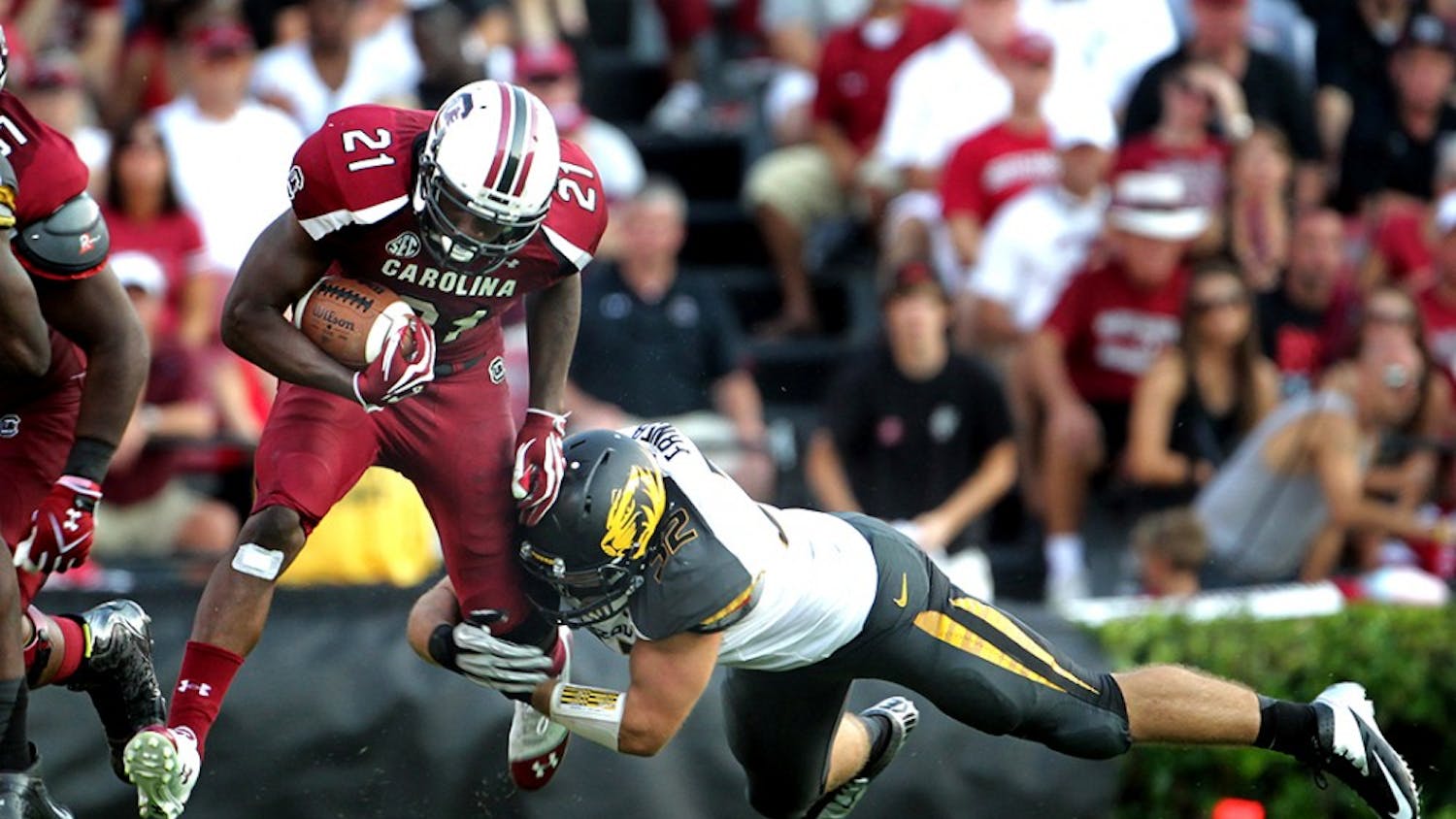University of South Carolina&apos;s Marcus Lattimore (21) breaks a tackle by Missouri&apos;s Will Ebner in the fourth quarter at William-Brice Stadium in Columbia, South Carolina, Saturday, September 22, 2012. South Carolina defeated Missouri, 31-10. (C. Aluka Berry/The State/MCT)