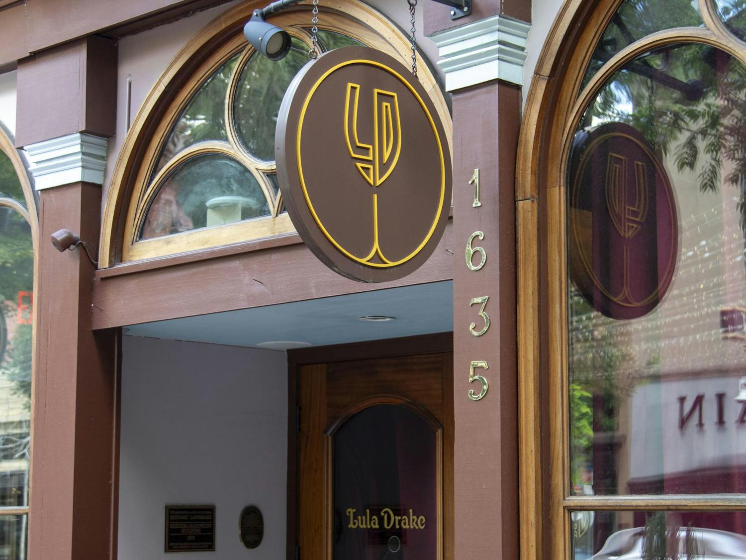 The Lula Drake Wine Parlour sign hangs on Main Street on June 29, 2024. Lula Drake Wine Parlour won a James Beard Award, which recognizes exceptional talent and achievement in hospitality.