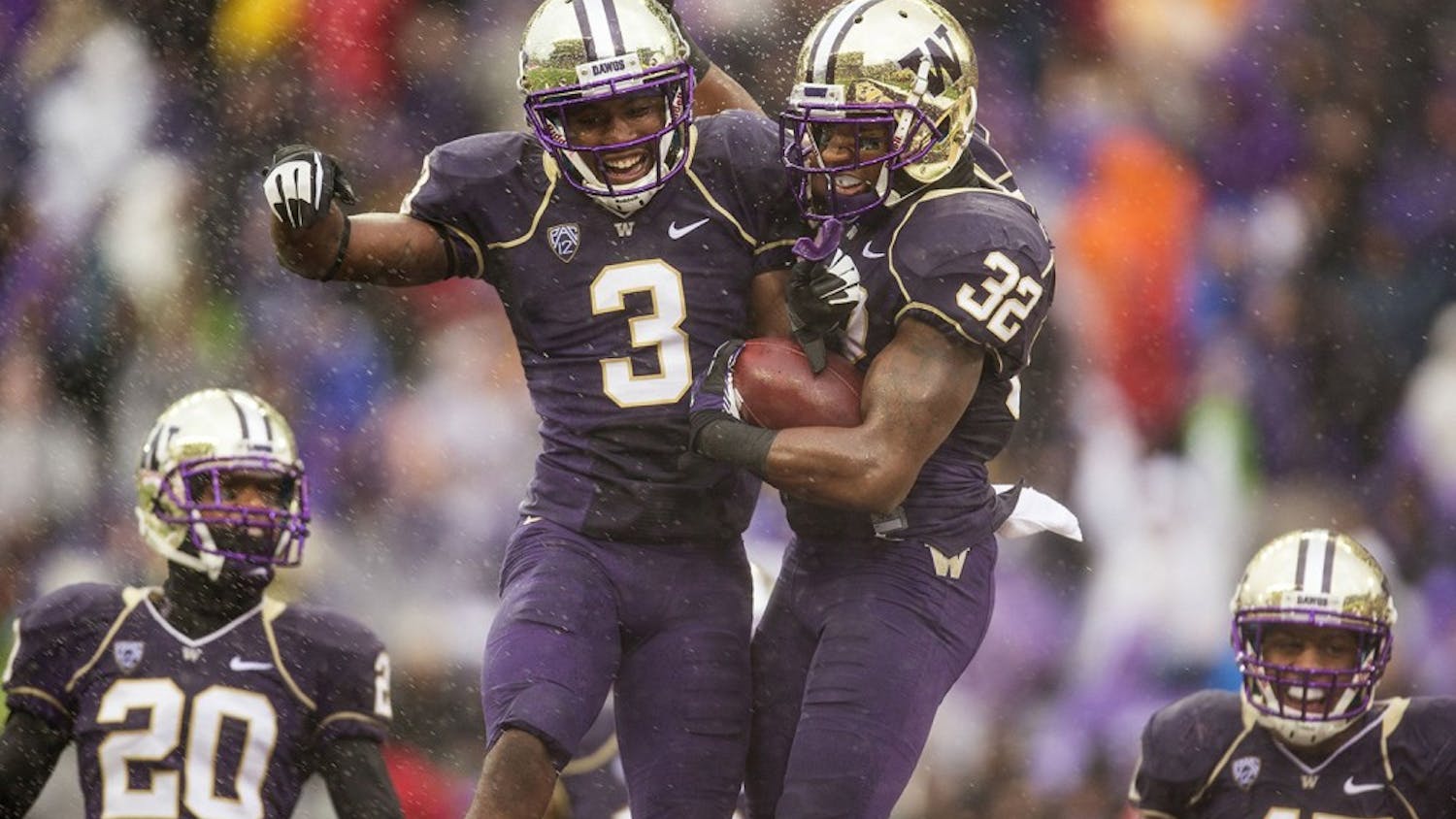 Washington&apos;s Cleveland Wallace (3) and Tre Watson (32) celebrate a safety against Arizona in the first quarter at Husky Stadium in Seattle, Washington, on Saturday, September 28, 2013. (Dean Rutz/Seattle Times/MCT)