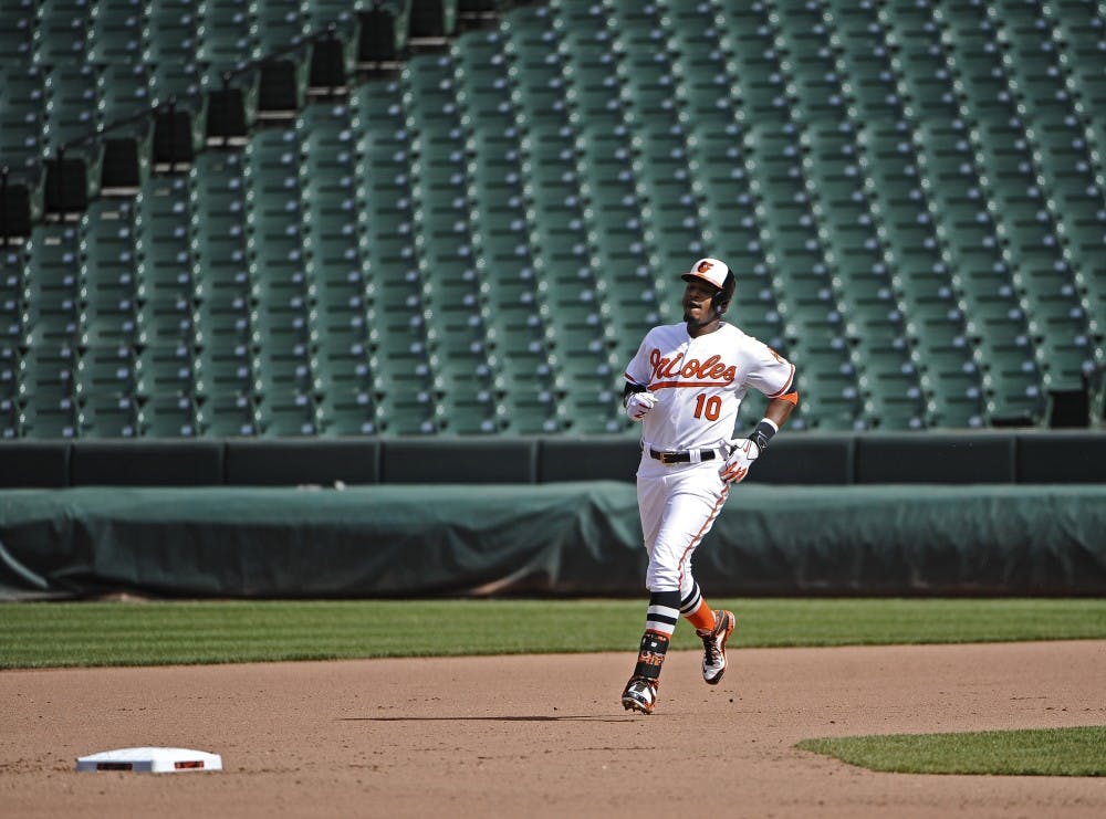 Baltimore Orioles' Adam Jones runs to second base on a double during the eighth inning on Wednesday, April 29, 2015, at Camden Yards in Baltimore. The game was closed to the public due to unrest in the city this week. (Kenneth K. Lam/Baltimore Sun/TNS)