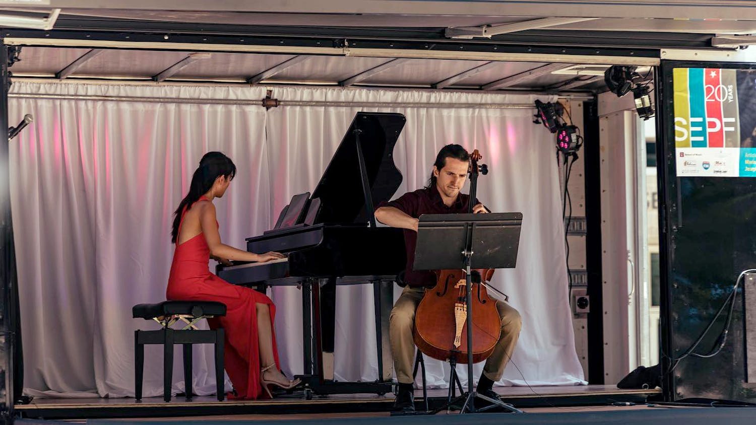 Susan Zhang and Nick Luby perform on the Concert Truck during the Southeastern Piano Festival. Zhang and Luby co-founded the Concert Truck in 2016, converting a 16-foot box truck into a portable stage.&nbsp;