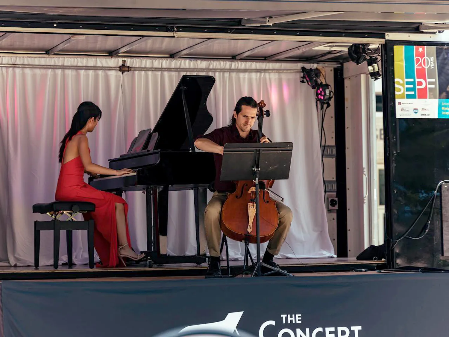 Susan Zhang and Nick Luby perform on the Concert Truck during the Southeastern Piano Festival. Zhang and Luby co-founded the Concert Truck in 2016, converting a 16-foot box truck into a portable stage. 