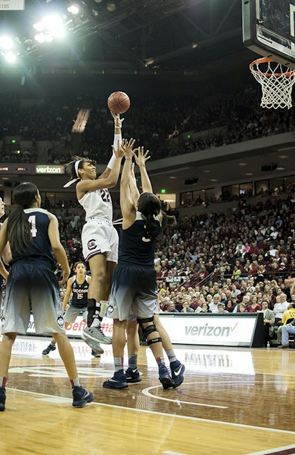 A'ja Wilson goes to make a shot against two UConn players. Wilson came in as a star freshman and has maintained her performance in the years of attending USC. 