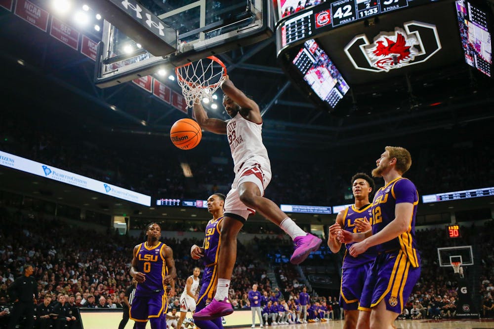 <p>FILE — Senior forward Josh Gray hangs on the rim of the basket during South Carolina’s game against LSU at Colonial Life Arena on Feb. 17, 2024. Gray scored 4 points in the Gamecocks' 64-63 loss to the Tigers.</p>
