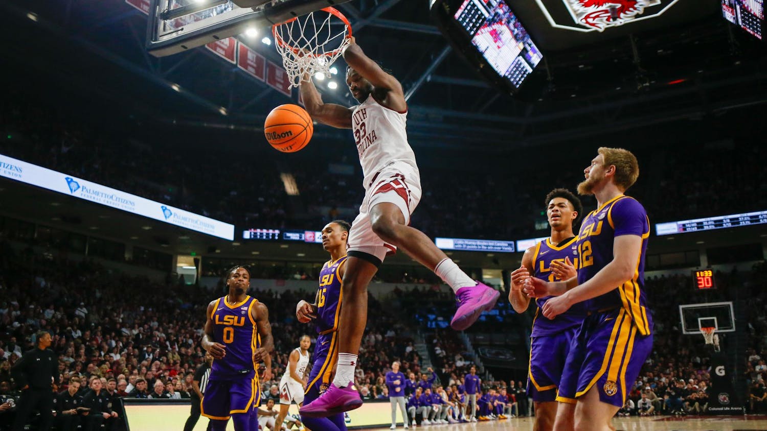 FILE — Senior forward Josh Gray hangs on the rim of the basket during South Carolina’s game against LSU at Colonial Life Arena on Feb. 17, 2024. Gray scored 4 points in the Gamecocks' 64-63 loss to the Tigers.