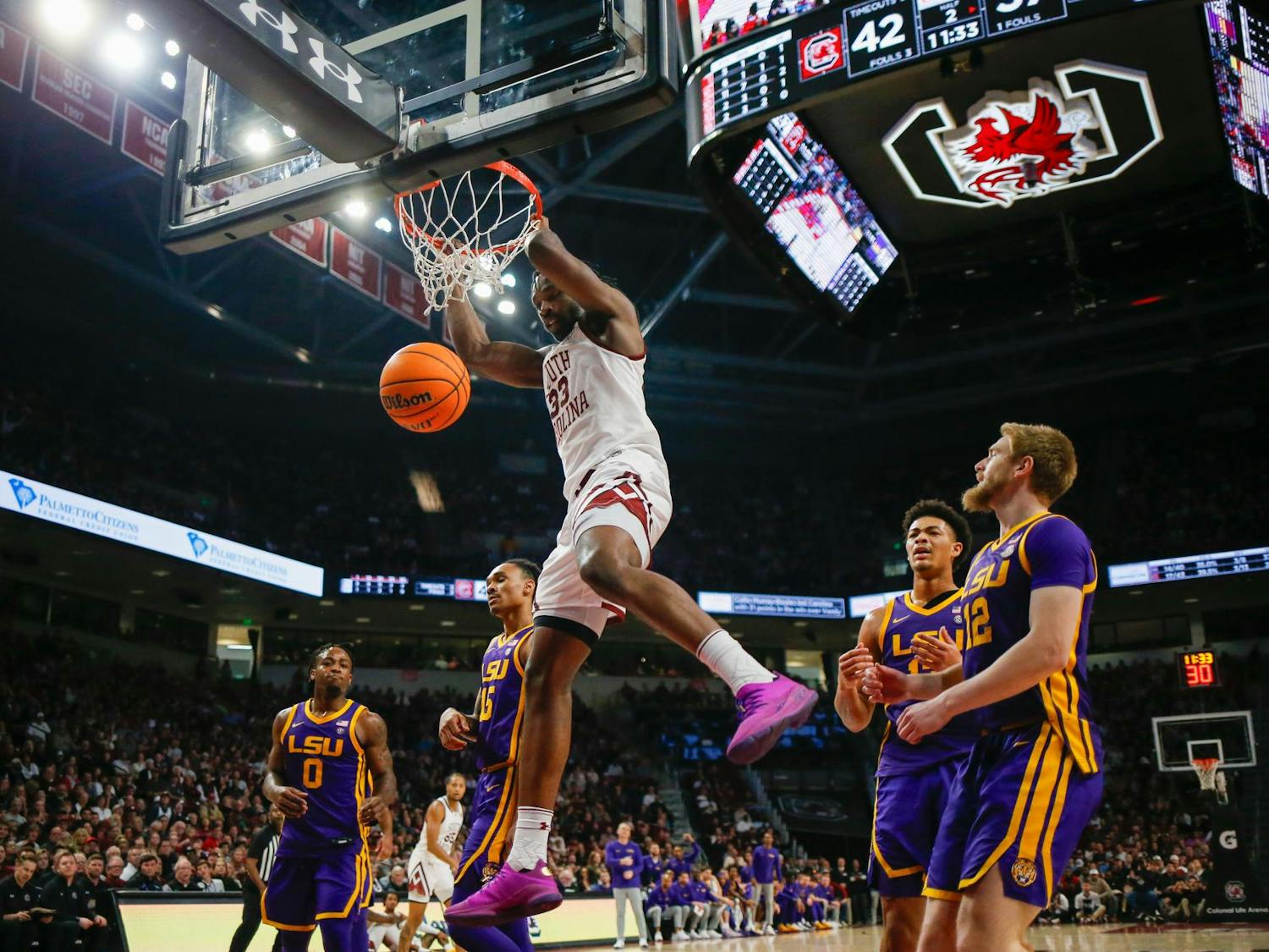 FILE — Senior forward Josh Gray hangs on the rim of the basket during South Carolina’s game against LSU at Colonial Life Arena on Feb. 17, 2024. Gray scored 4 points in the Gamecocks' 64-63 loss to the Tigers.
