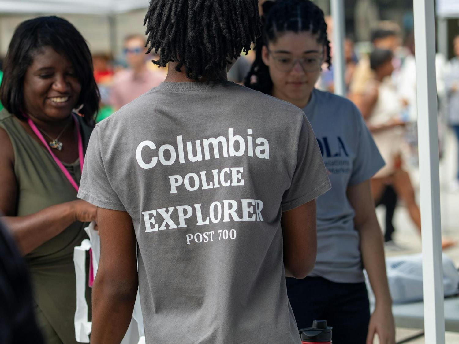 The back of a shirt that reads "Columbia Police Explorer" at a table during Sistercare Saturdays on July 27, 2024. Sistercare Saturdays was hosted at the Soda City Market from 10 a.m. to 3 p.m.