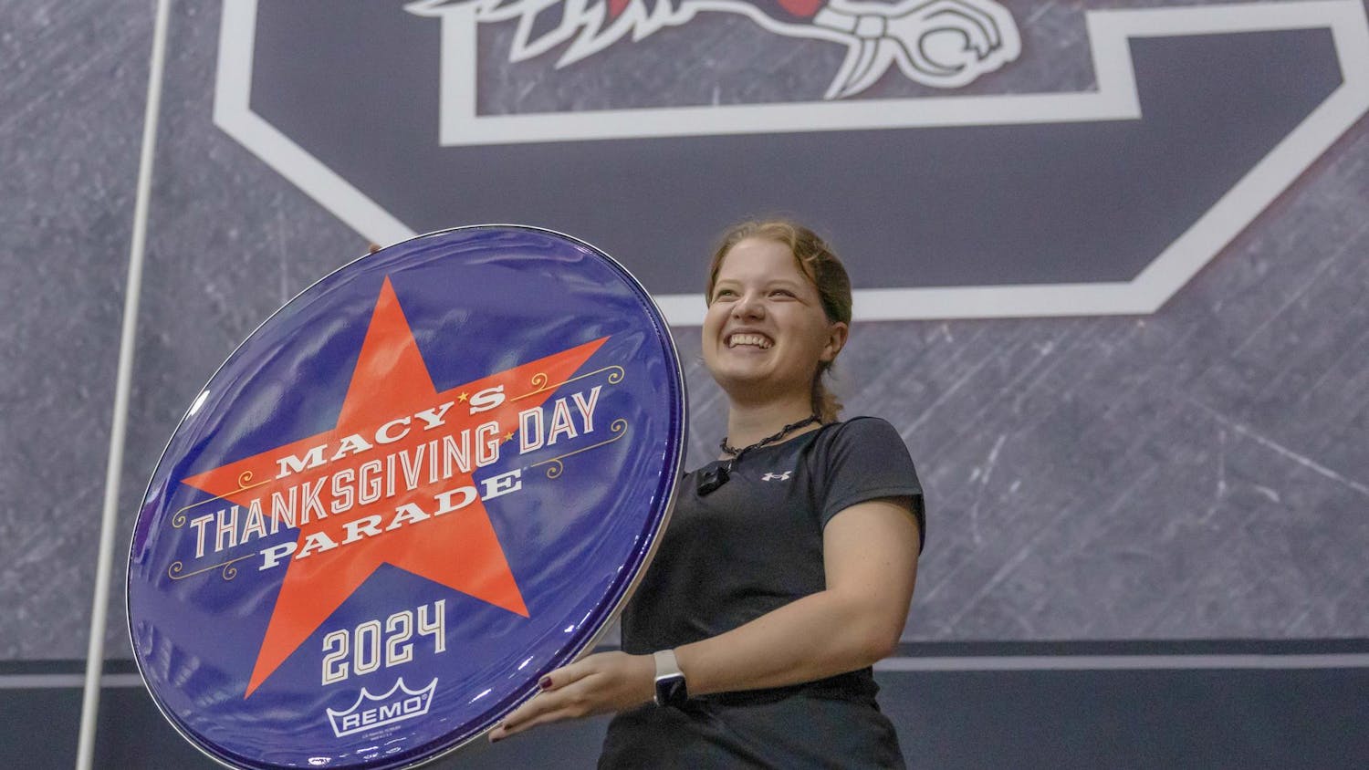 Fourth-year public health student Meredith Rhodes holds a 2024 Macy's Thanksgiving Day Parade drumhead. The Carolina Band will perform during the parade on Nov. 28, 2024.