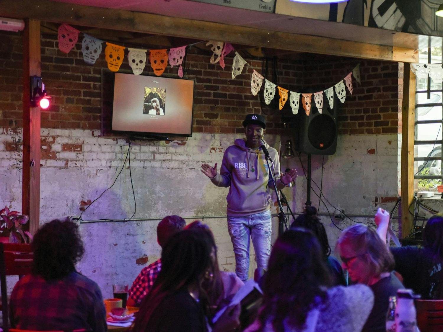 Tam The Viibe introduces Curiosity Coffee Bar’s Open Mic night on Oct. 15, 2024. This event, along with others, was a part of South Carolina Pride week.