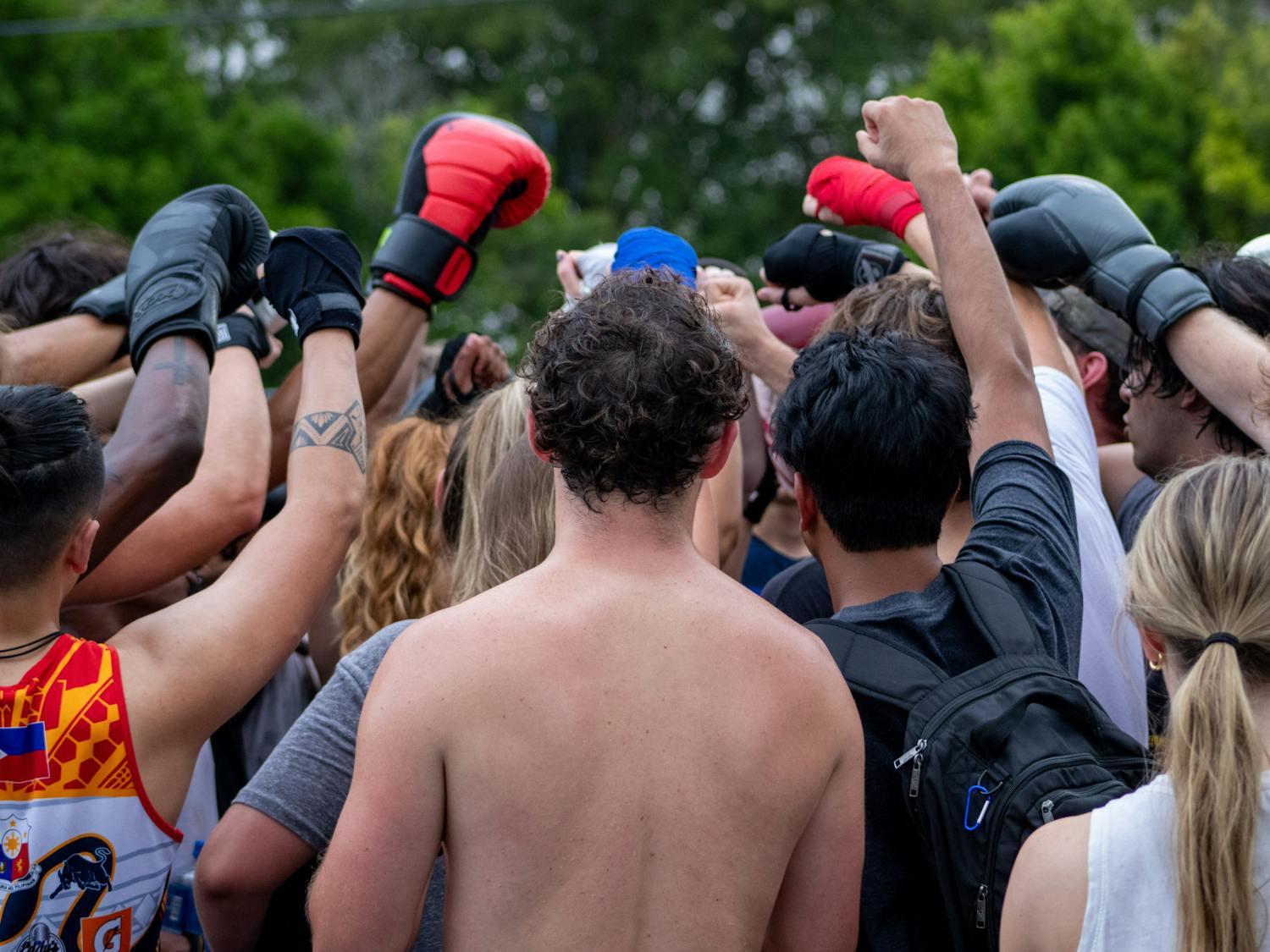 Members of the Carolina Boxing Club raise their fists up in a final salute to conclude training. The Carolina Boxing Club gathered Sept. 12, 2022, at Battle Boxing Gym to prepare for the upcoming season.  