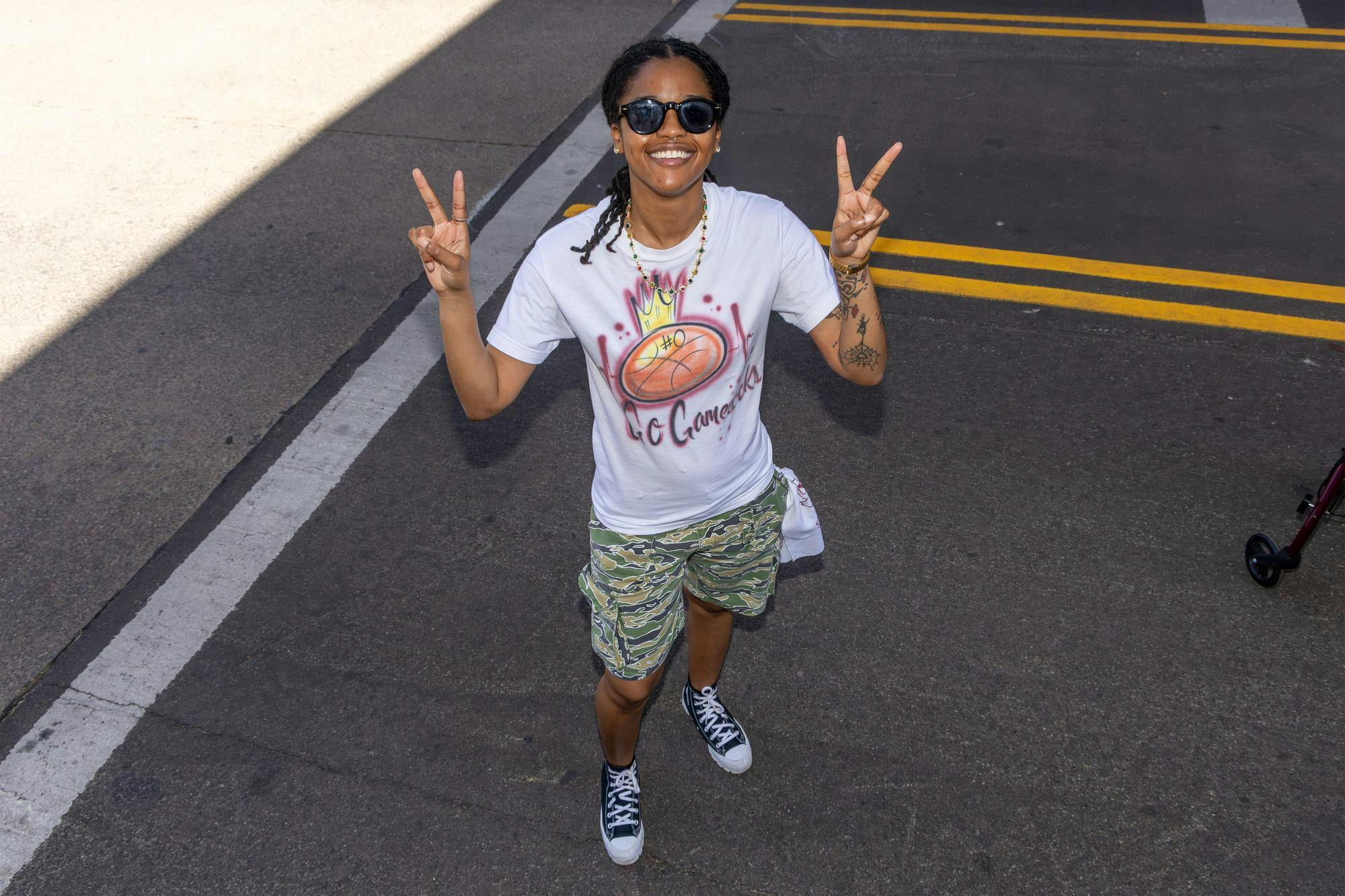 Savannah, Georgia, resident Haley McNeil poses on the streets at Tourney Town during the Final Four in Phoenix, Arizona, on April 3, 2026. McNeil traveled with her friends' family, all of whom are Gamecock fans, to Phoenix, which has become a tradition.
