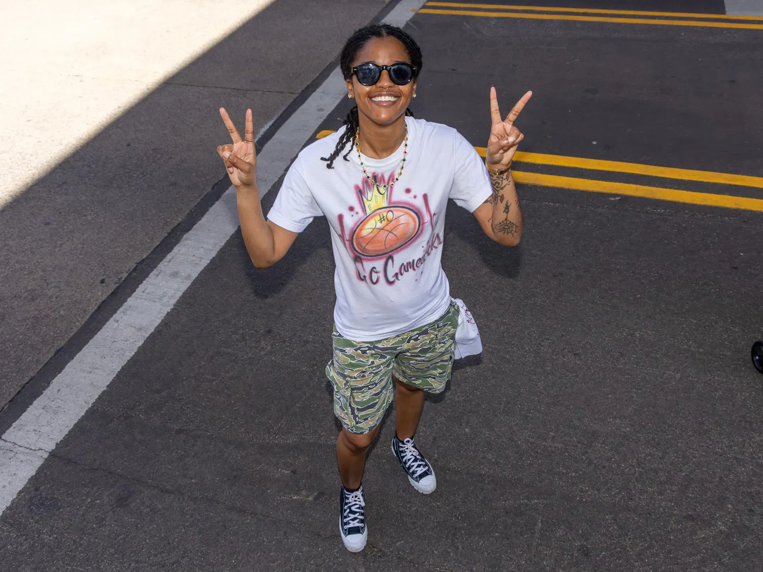 Savannah, Georgia, resident Haley McNeil poses on the streets at Tourney Town during the Final Four in Phoenix, Arizona, on April 3, 2026. McNeil traveled with her friends' family, all of whom are Gamecock fans, to Phoenix, which has become a tradition.