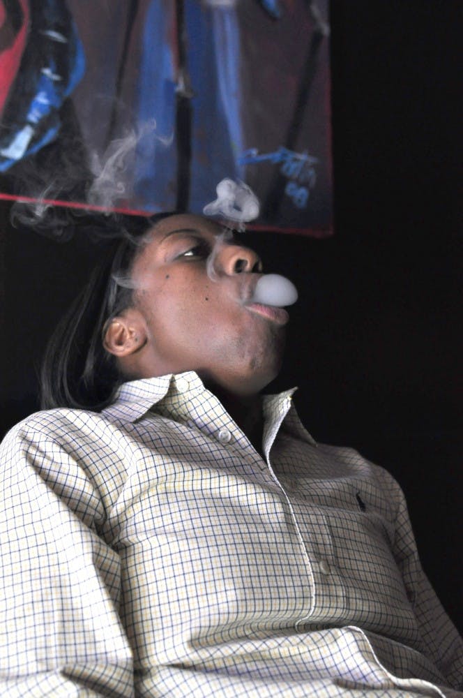 	Ada Owens (above), a USC graduate, is one of two owners of the Hookah Spot, a new, suave tobacco lounge in Five Points.
