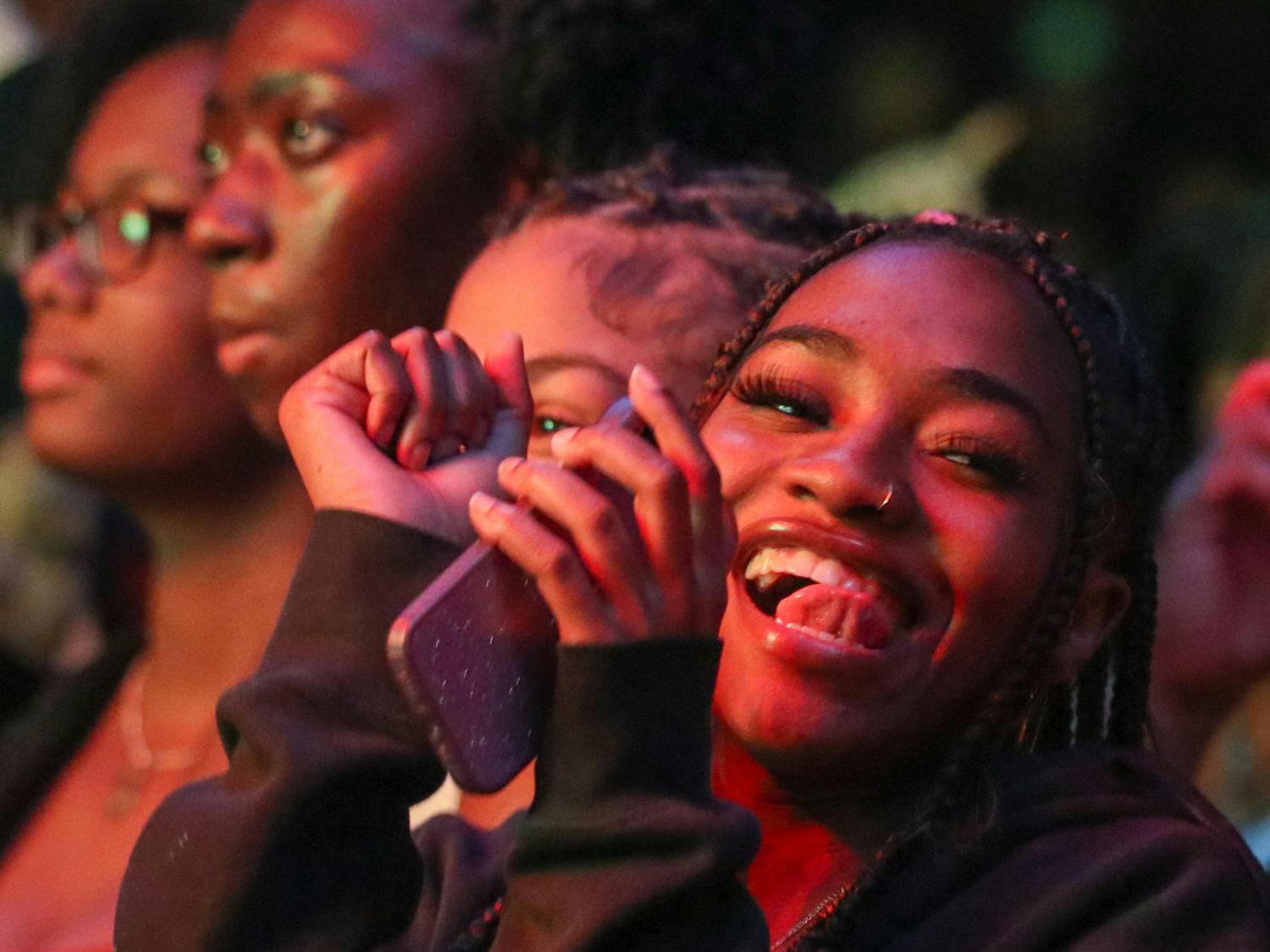 A student at the front of the pit dances while waiting for the main event. T-Pain was the headliner of Cockstock, held on Oct. 21, 2022. 
