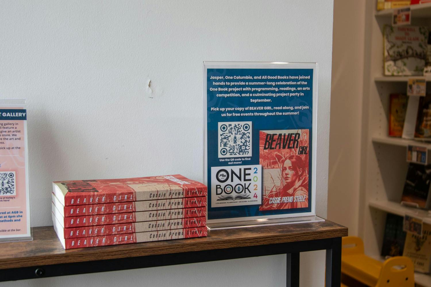 Copies of Cassie Premo Steele's book Beaver Girl sit on a table by the entrance of All Good Books on June 30, 2024. Steele's book is part of a program called One Book, which provides programming, events and more for the Columbia community.