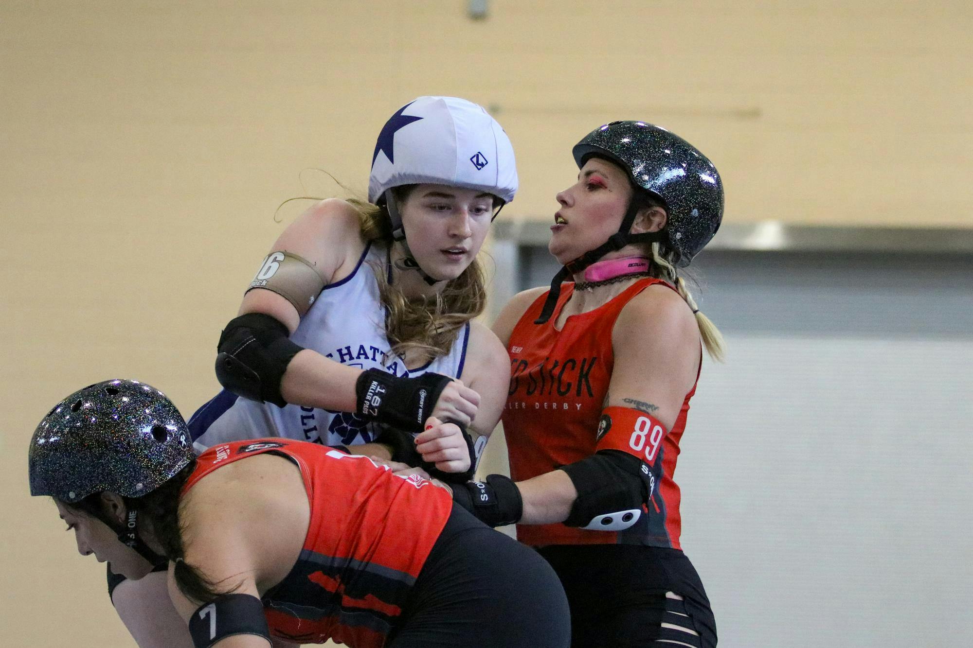 Chattanooga All Star skater Abby “Duck” Duckworth pushes to move past Red Stick All Star skaters at St. Andrews Park on March 21, 2026. Jammers are skaters who score points for their team by passing their opponents as many times as possible and lapping the pack. “I mostly jam,” Duckworth said. “They got me really good in those holds, so really anything I could do to bust out, I was trying to do.”