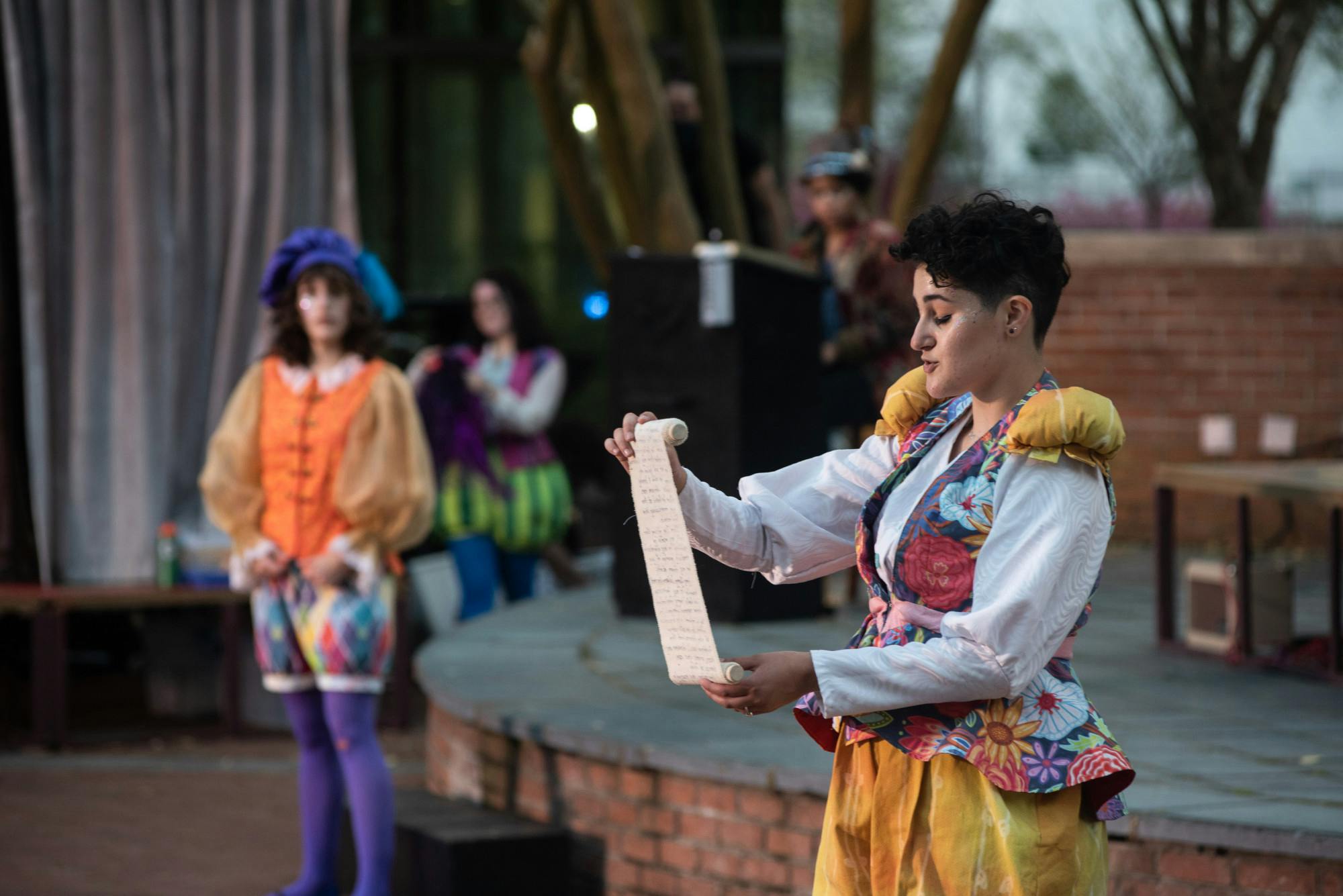 Performers of the USC Theatre Department take part in a production of “The Complete Works of William Shakespeare (Abridged),” performed on the Russell House patio stage in March 2021.