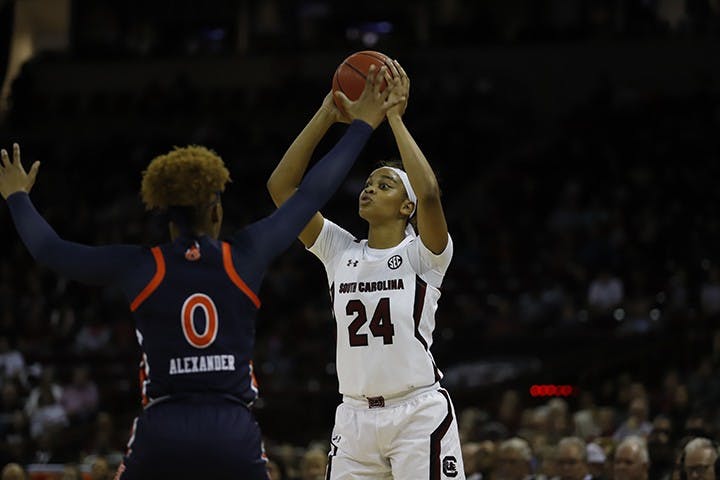Senior guard Lele Grissett looks for a teammate to pass the ball to during a game against Auburn. During her time at USC, Grissett had a total of 635 points, 63 blocks and 93 assists.