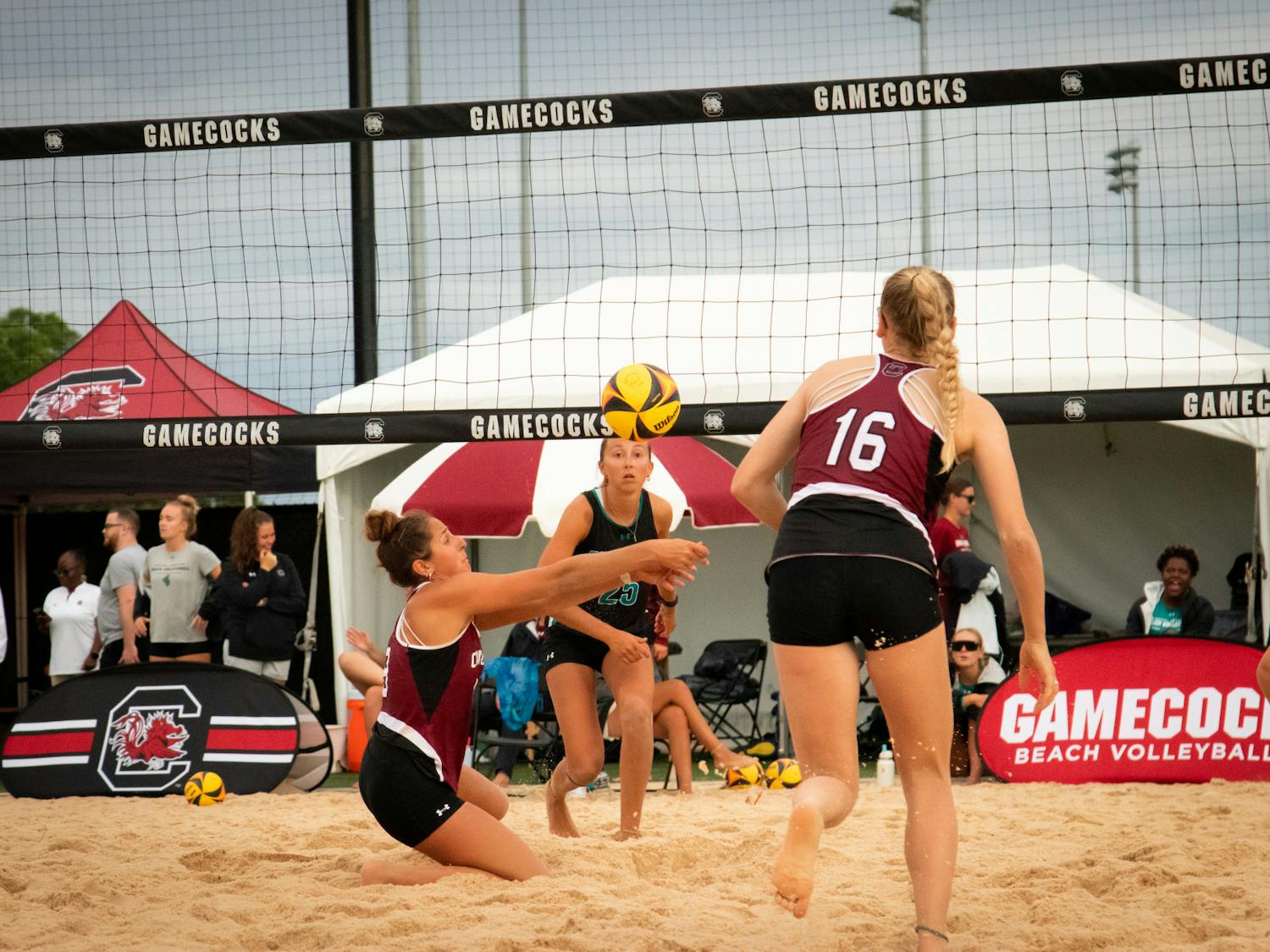 Freshman Jolie Cranford lunges for the ball in her match-up against Coastal Carolina on April 14, 2023. Cranford and teammate sophomore Kennedy Westendorff were able to score another point for the Gamecocks.