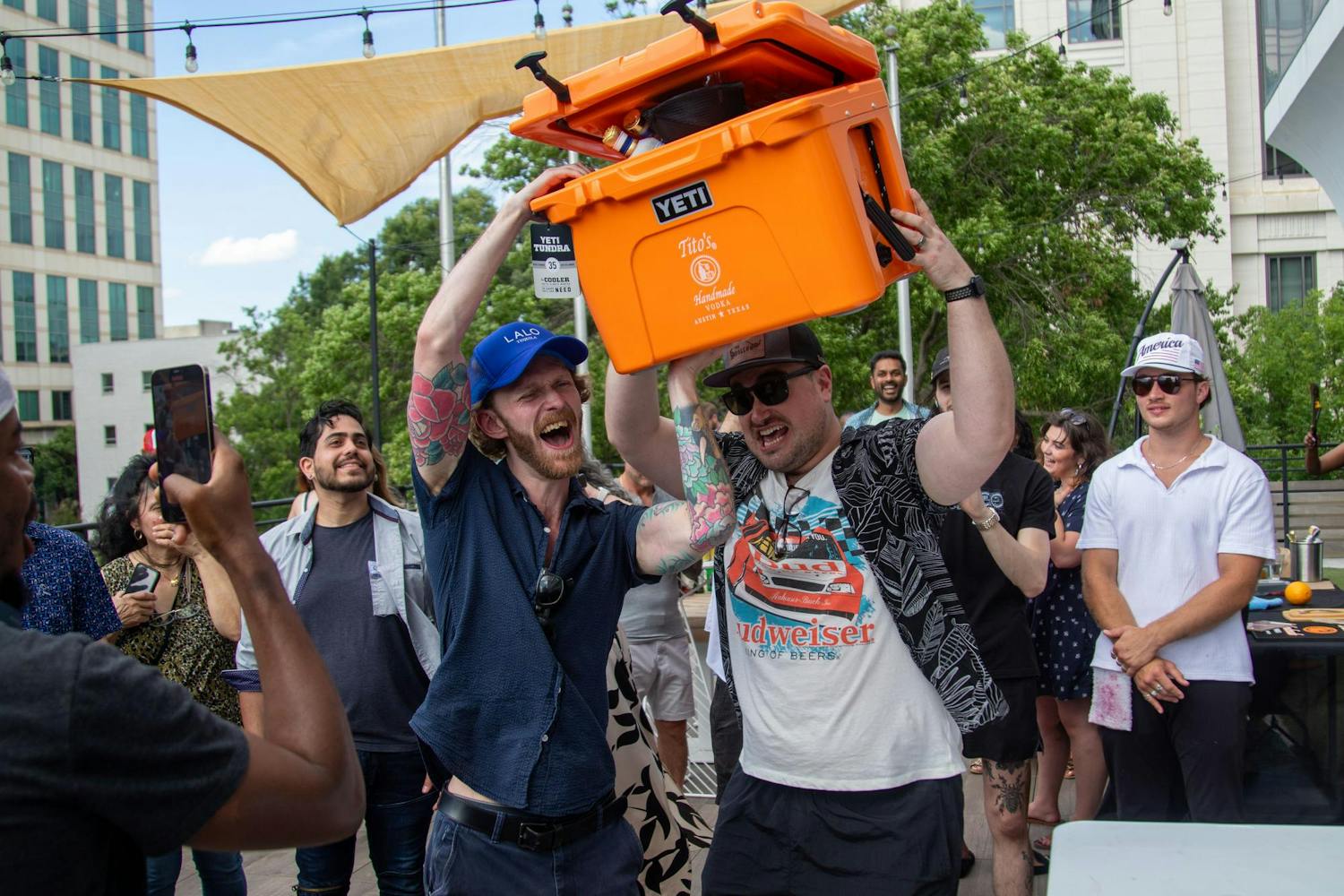 Grant McCloskey, the bar manager at The Hollow on Gervais, displays his prize after winning the competition on June 9, 2024. As one of the two winners, McCloskey received an array of cocktail ingredients packaged in a Yeti cooler.