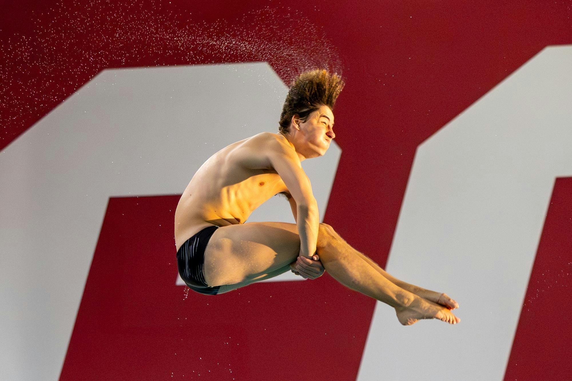 Junior diver Max Spencer flips during a dive on Nov. 7, 2025, at the Carolina Natatorium. Spencer finished in first place for the men’s 3-meter diving event against the North Carolina Tar Heels with a score of 370.43.