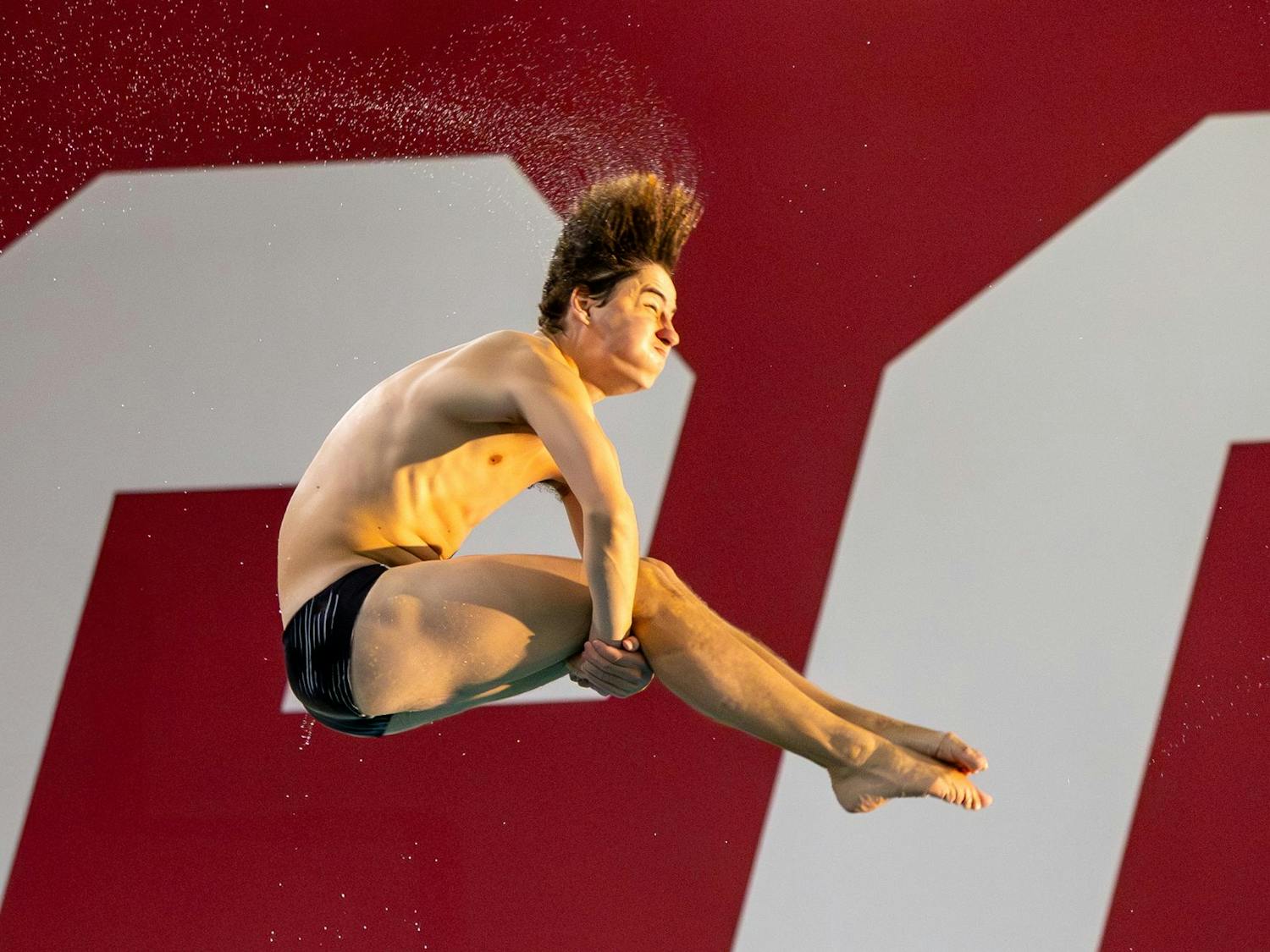 Junior diver Max Spencer flips during a dive on Nov. 7, 2025, at the Carolina Natatorium. Spencer finished in first place for the men’s 3-meter diving event against the North Carolina Tar Heels with a score of 370.43.