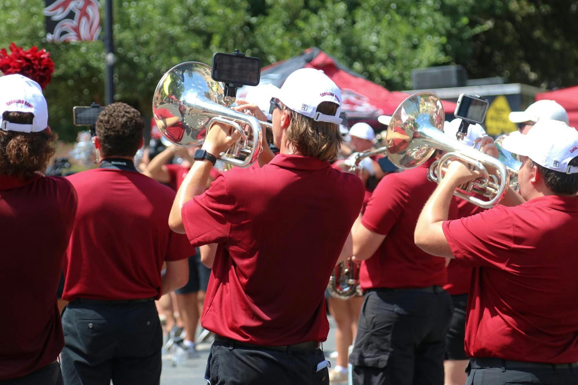 FILE — A Carolina Band member plays their instrument during the Carolina Kickoff event on Greene Street on Aug. 30, 2024. The band played a variety of songs from its typical game-day lineup to prepare students for the first home football game of the season.